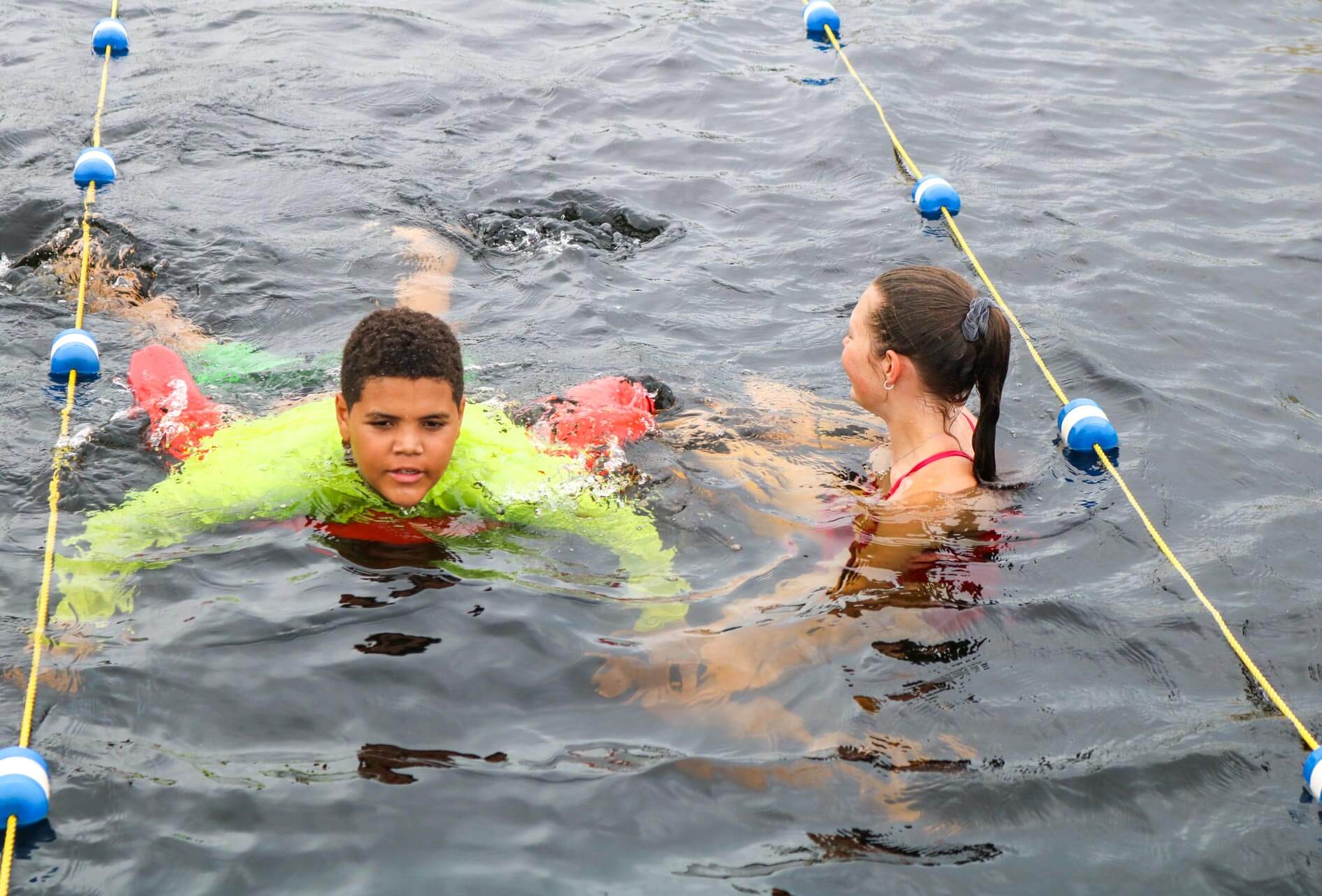 Camper uses noodle during swim instruction