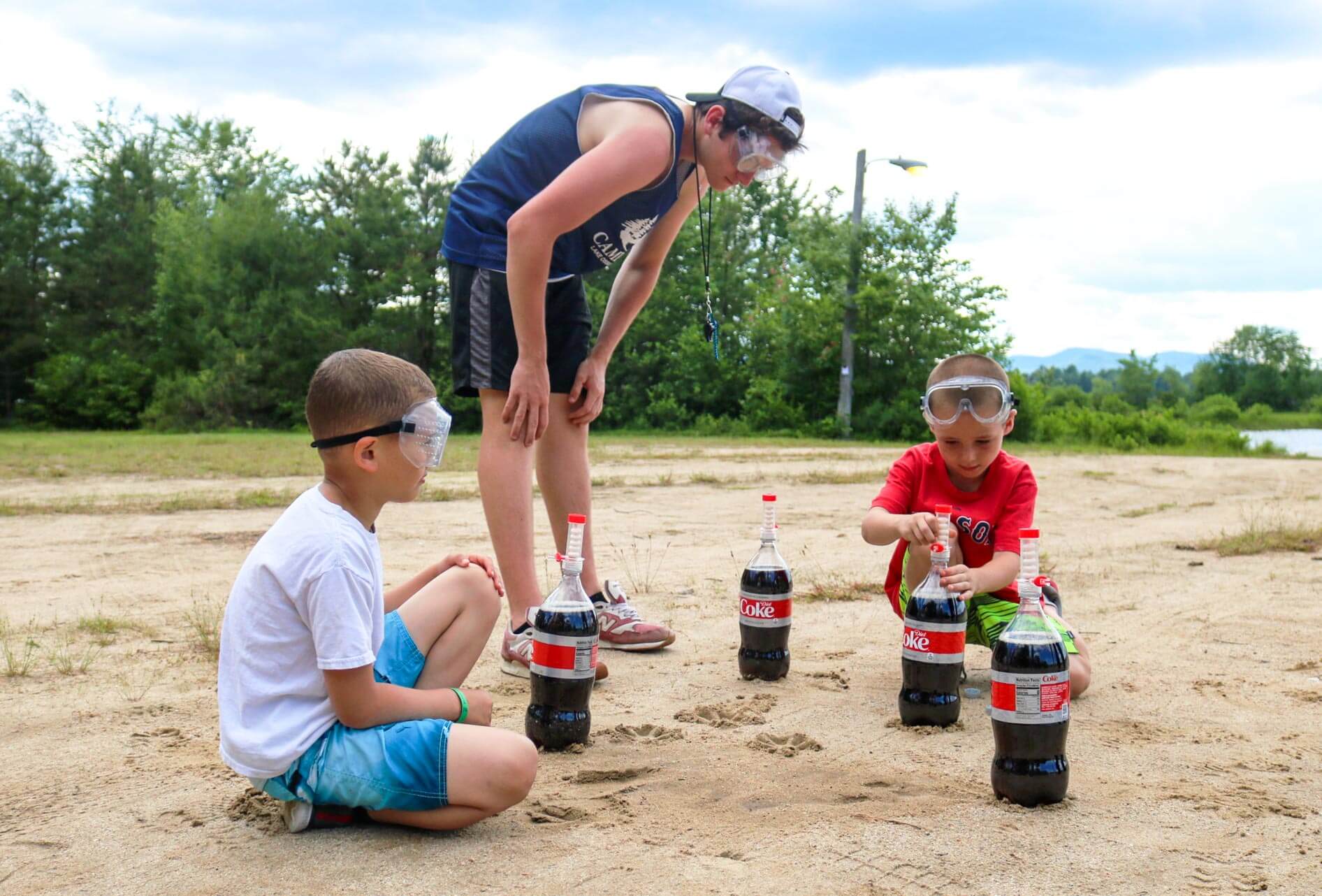 Counselor oversees young campers with Coke and Mentos